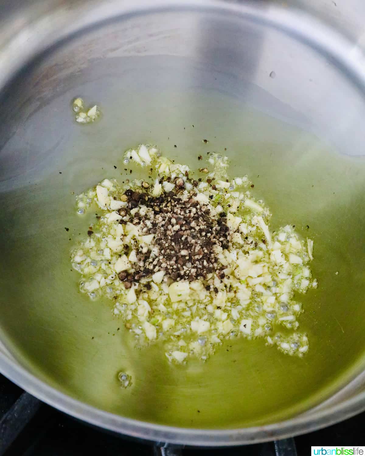 cooking garlic and pepper in pan
