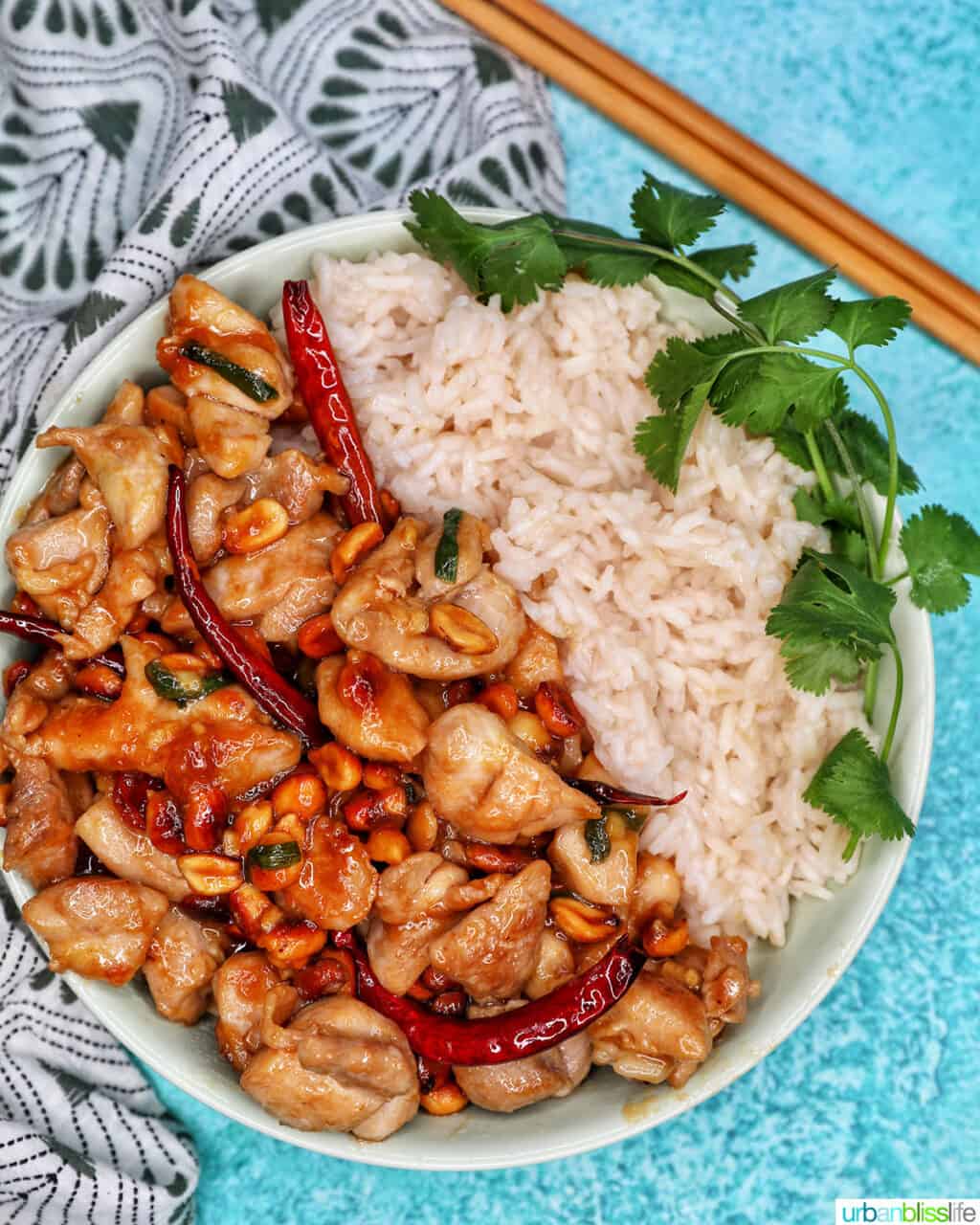 Kung Pao Chicken with rice and chopsticks