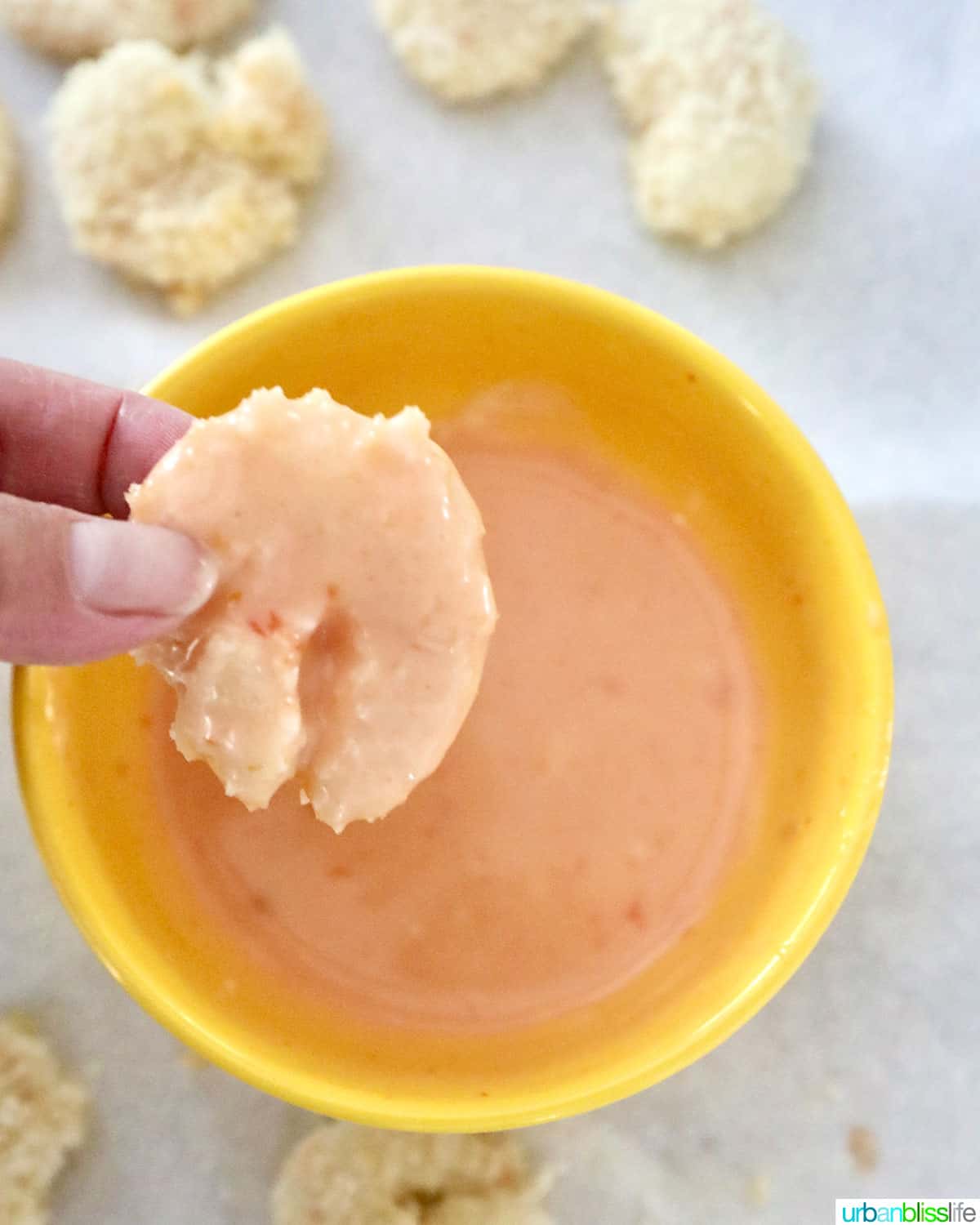 dip shrimp into bang bang sauce