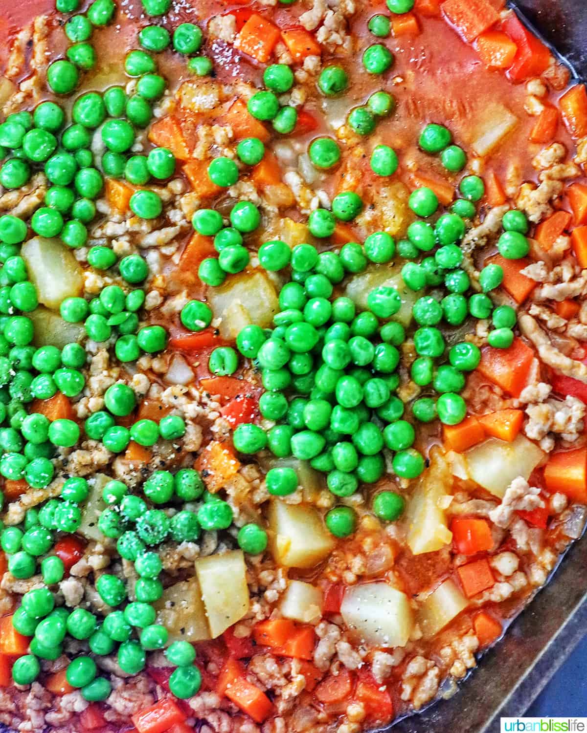 adding peas to menudo