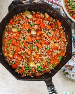ground pork menudo in a cast iron skillet