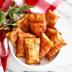air fryer pizza rolls in a white bowl.