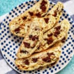 chocolate chip almond biscotti on a polka dot plate.