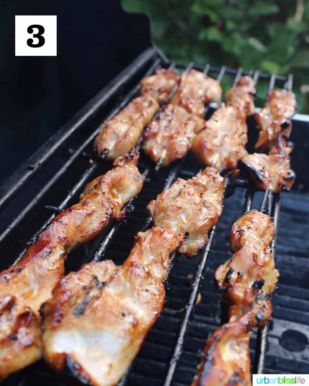honey garlic chicken skewers on grill.