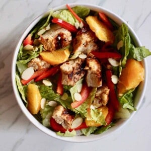 grilled orange chicken salad with honey and veggies.