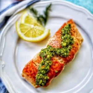 pan seared salmon with almond pesto and lemon.