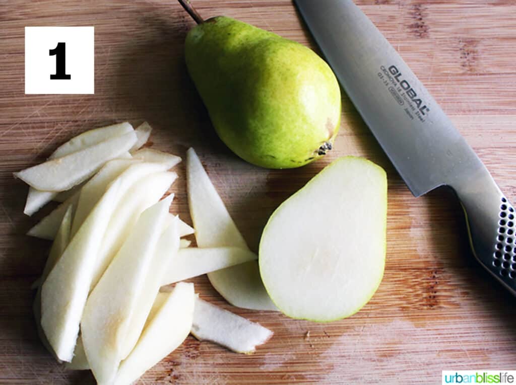 sliced bartlett pears and a full pean along with a chef's knife.