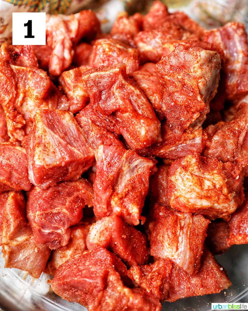 raw pork shoulder being prepped for pulled pork.