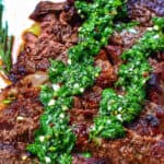 rib eye steak with chimichurri sauce.