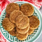 soft ginger molasses cookies on a patterned plate.