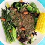 grilled steak with cilantro almond pesto and corn.