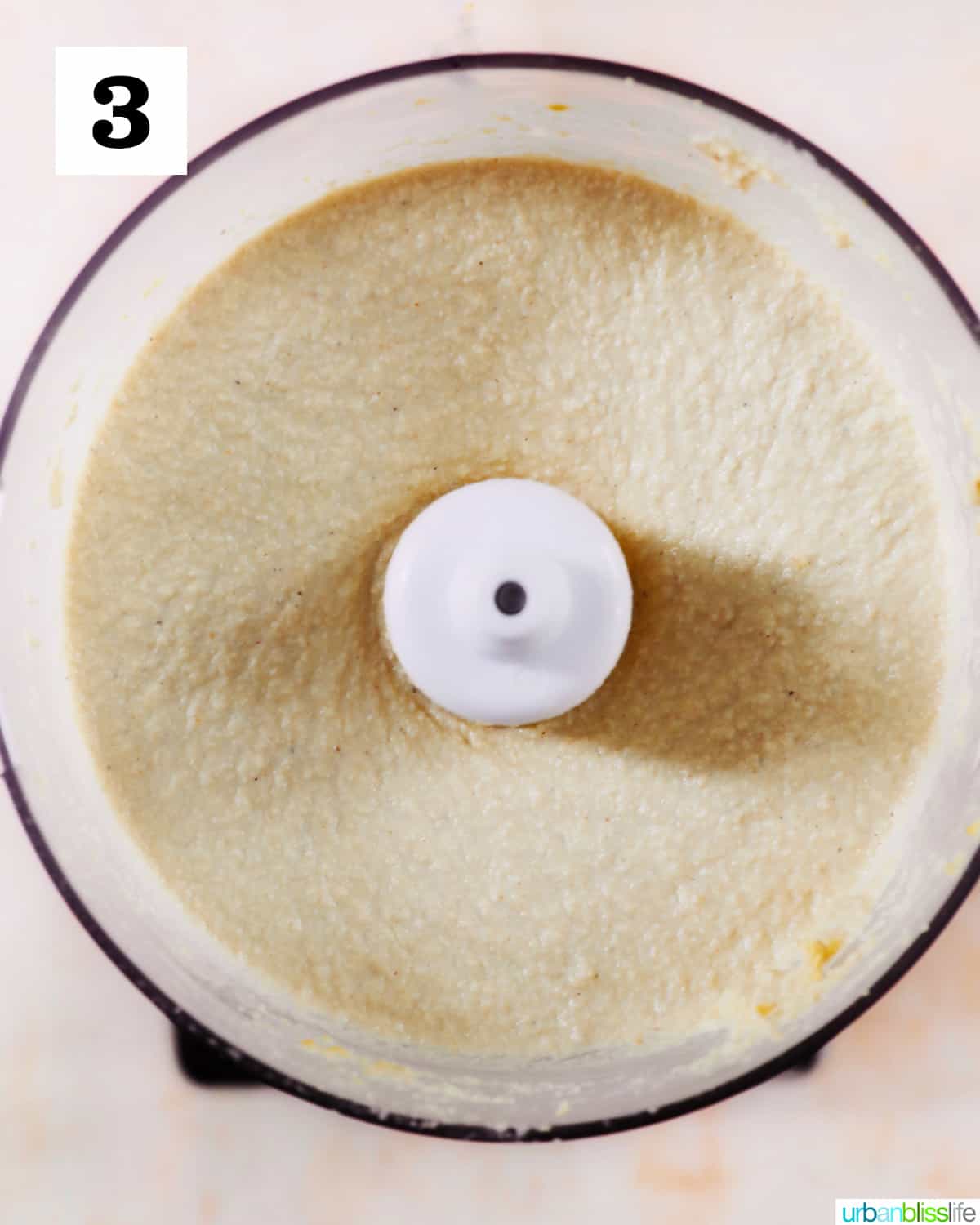 Vegan Cashew Cheese blended smoothly in a food processor.
