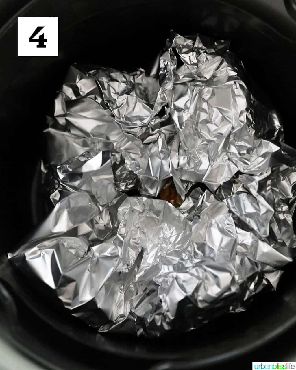 aluminum foil in an air fryer basket.