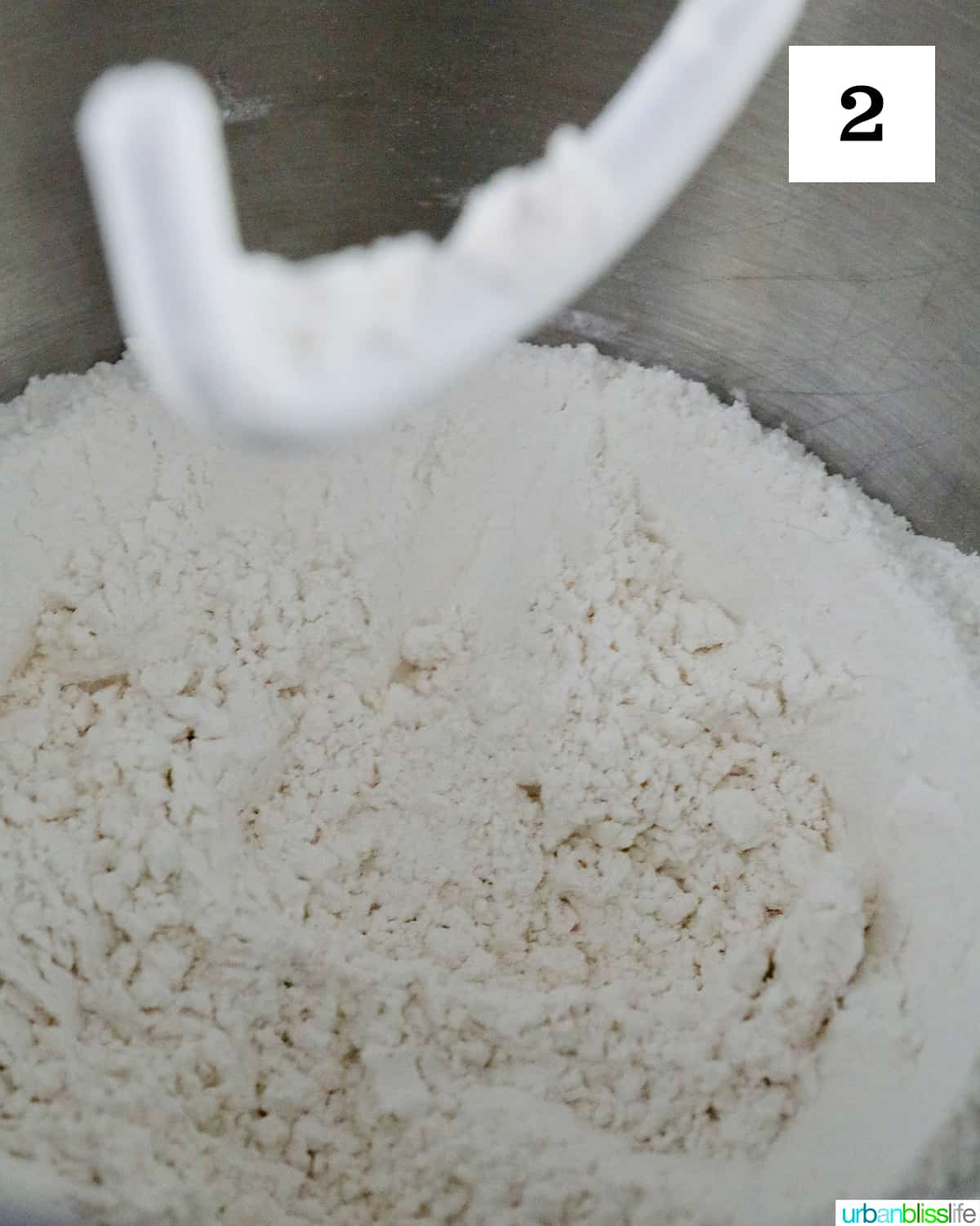 bread batter in a mixer with rough hook.