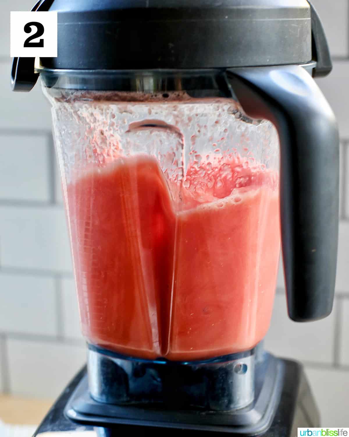 blended watermelon mimosas in a blender.