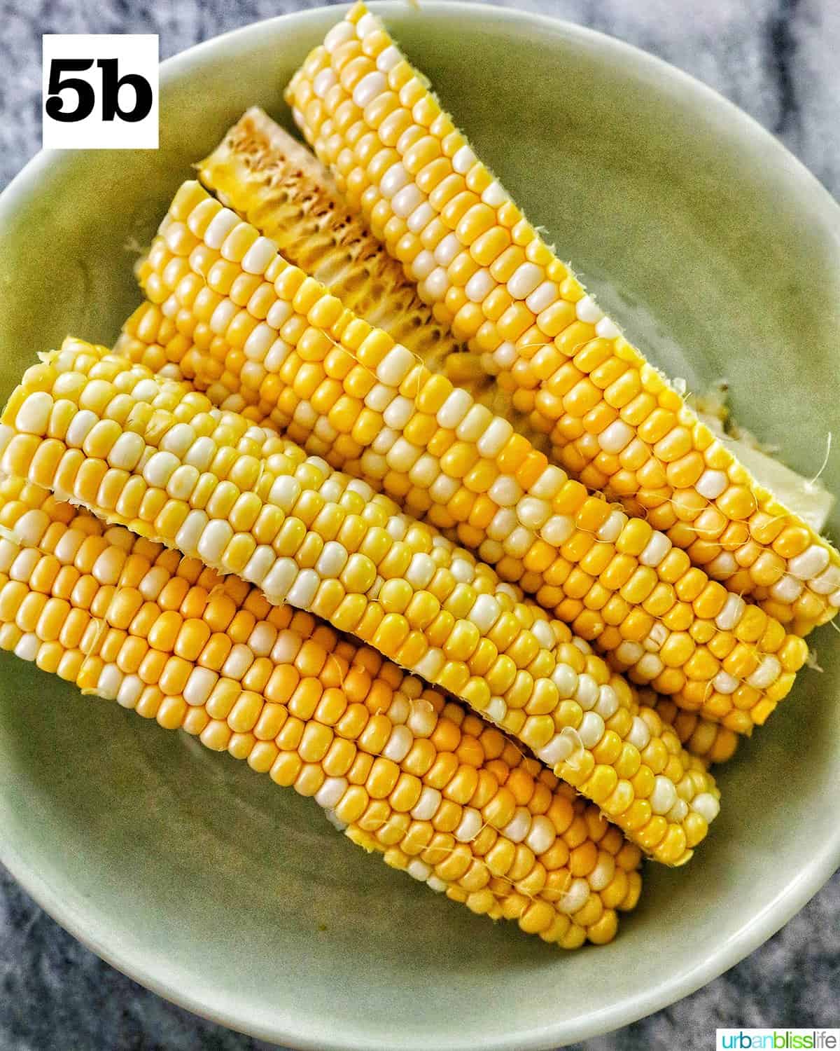 bowl of sliced raw corn ribs.
