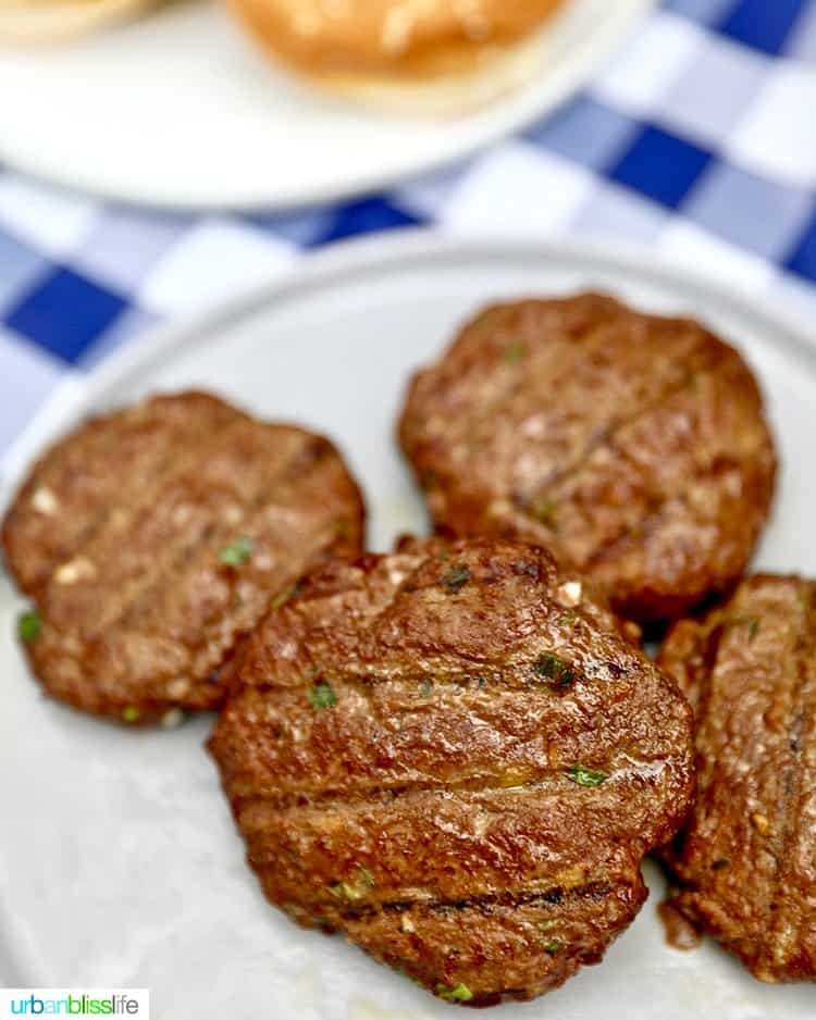 asian burgers done grilling on plate.