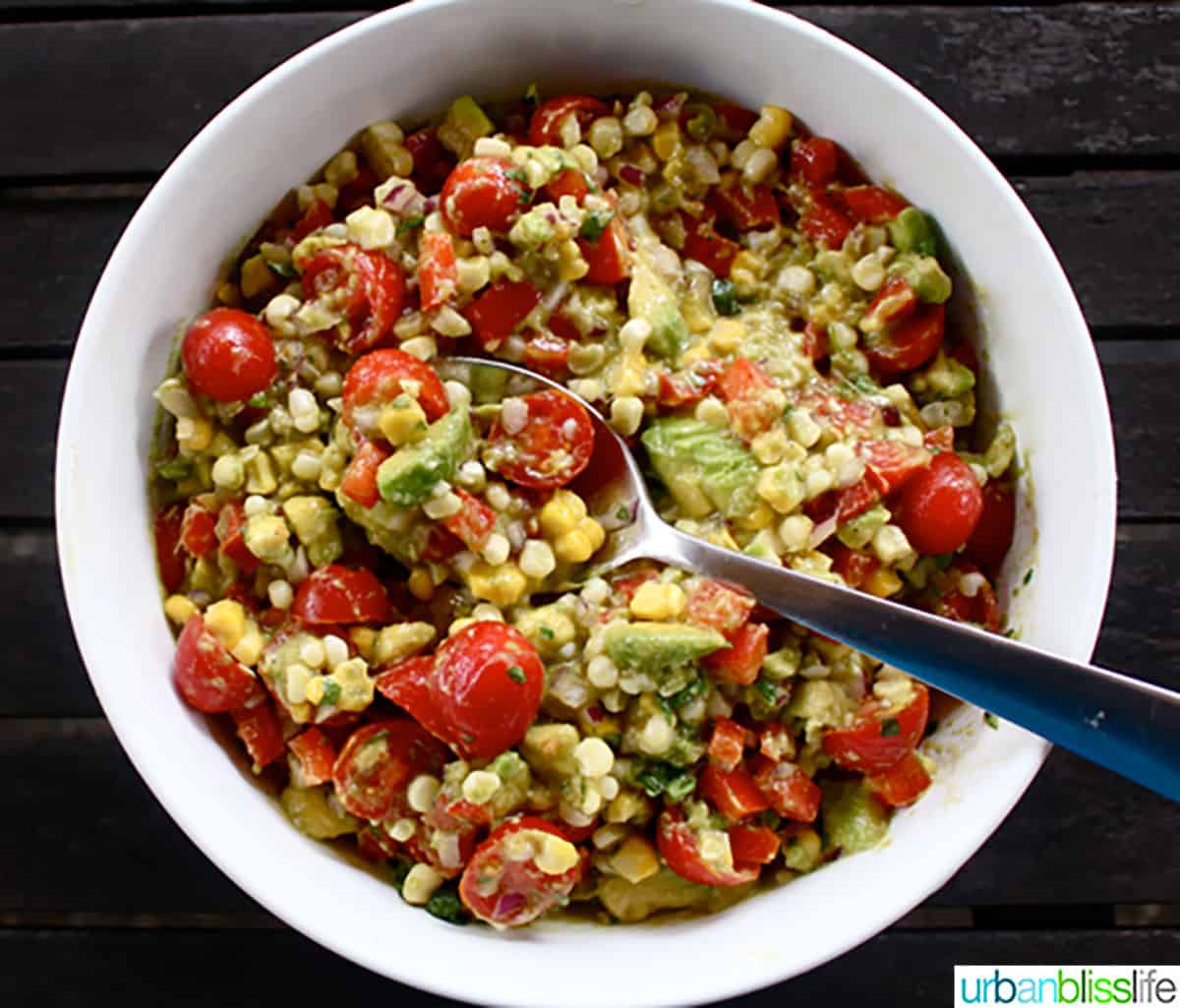 Avocado Corn Salad with spoon and bowl.