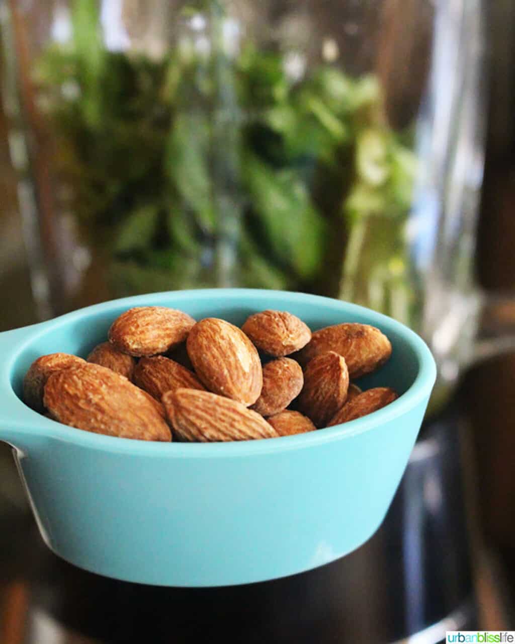 almonds in blue measuring cup.