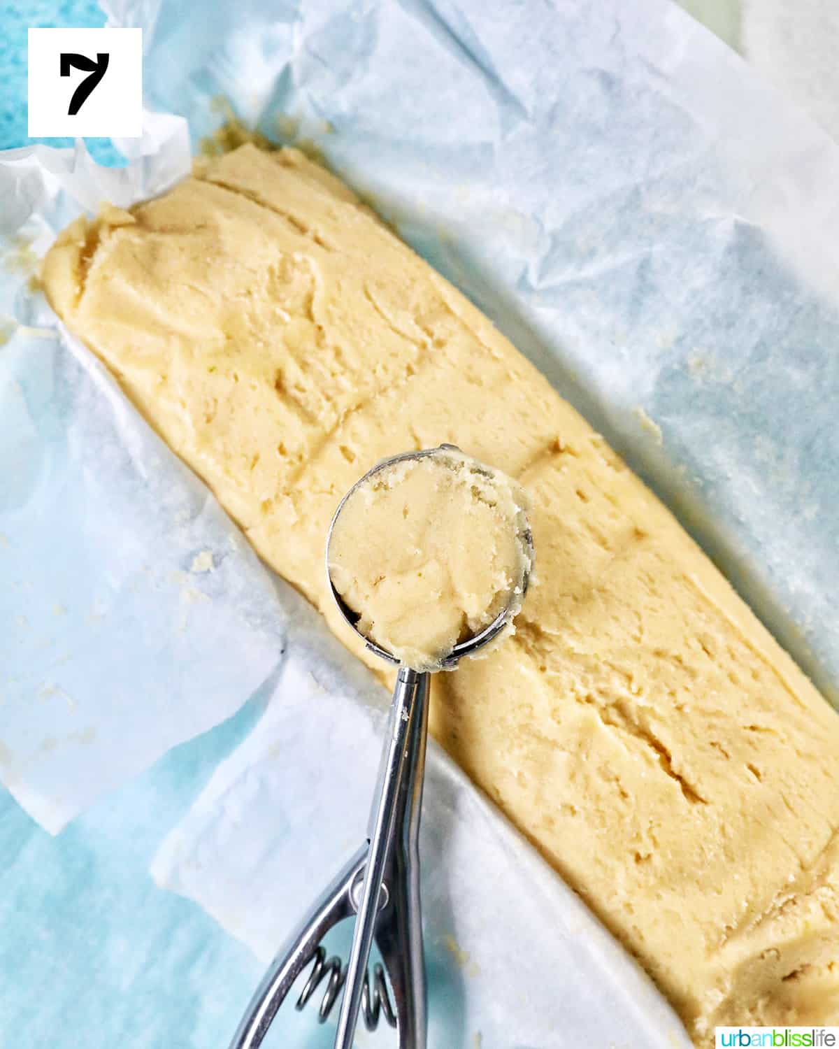 scoop taking key lime cookie batter out of chilled dough.