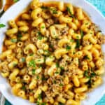 bowl of dairy free one pot cheeseburger pasta with ground turkey and chopped parsley.
