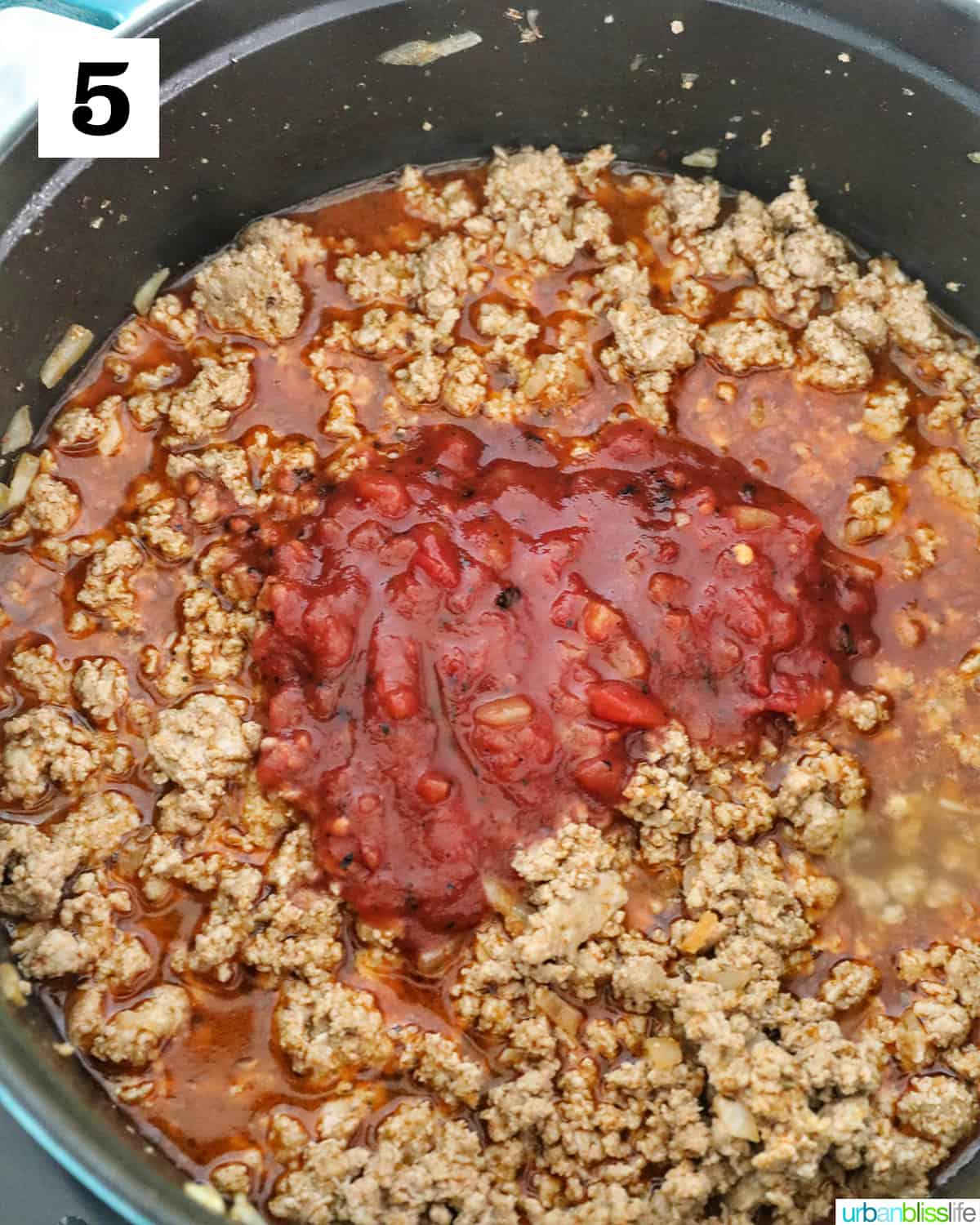 adding tomatoes to meat