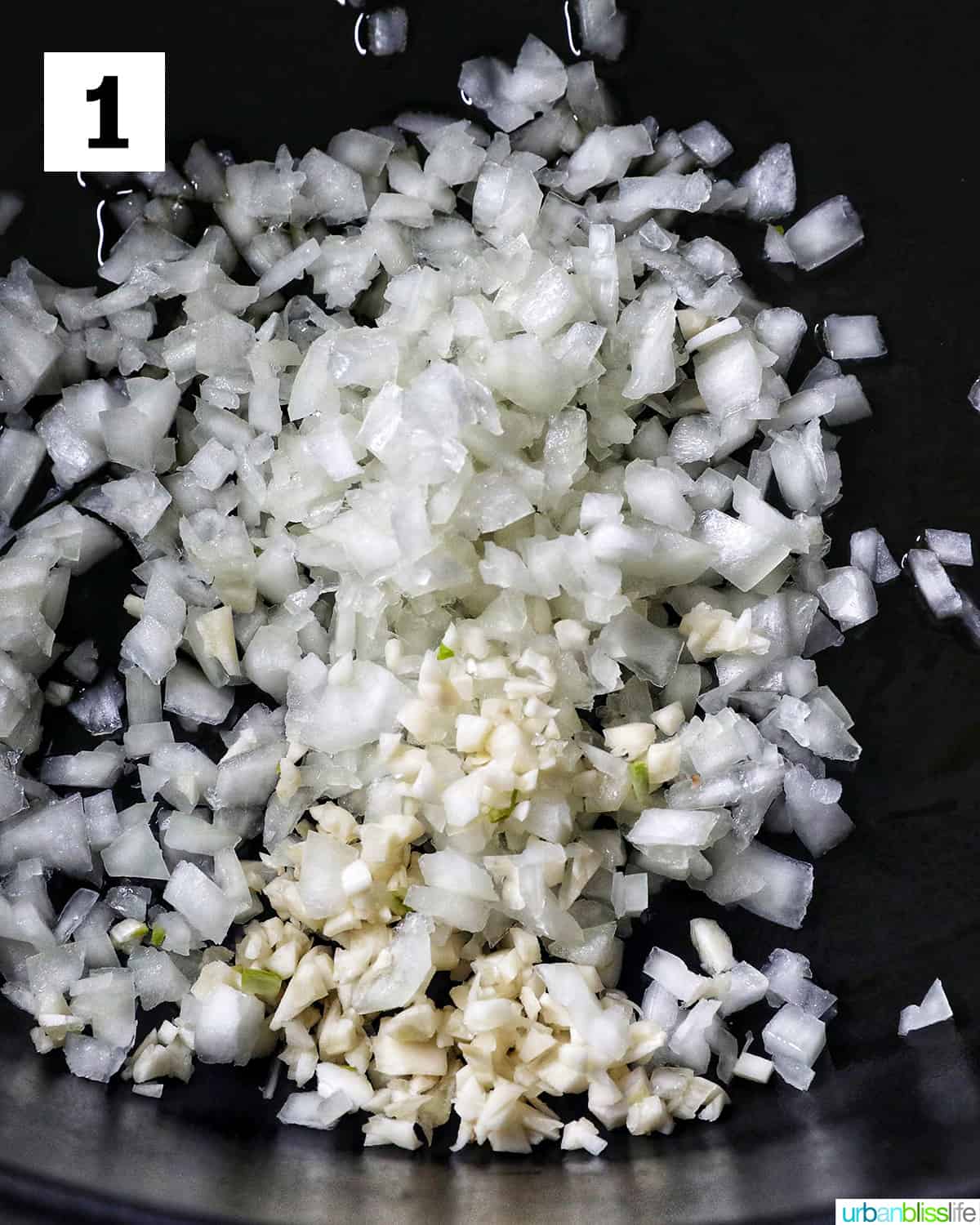 chopped garlic and onions sauteing in a dutch oven.