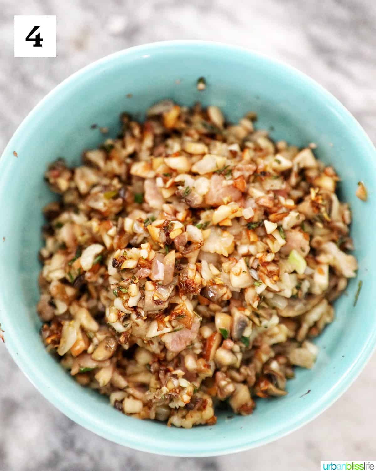 blue bowl with chopped mushroom mix.