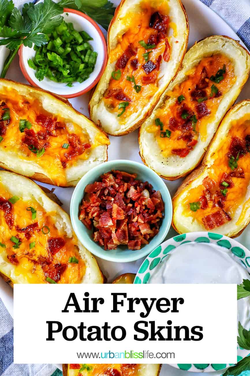 several air fryer potato skins with sides of green onions, bacon, and sour cream with title text overlay.