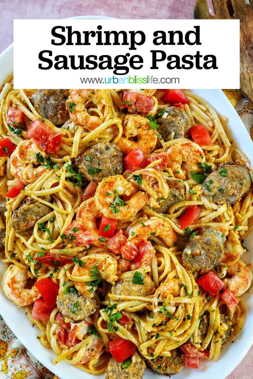 Shrimp and Sausage Pasta in a large serving platter with title text overlay.