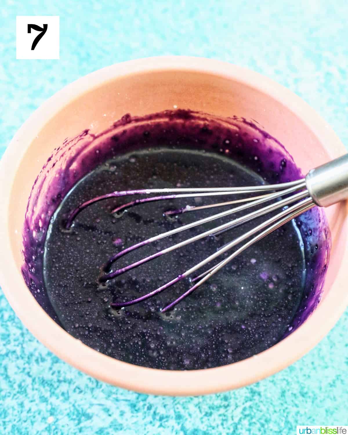 whisk in a bowl of purple ube glaze.