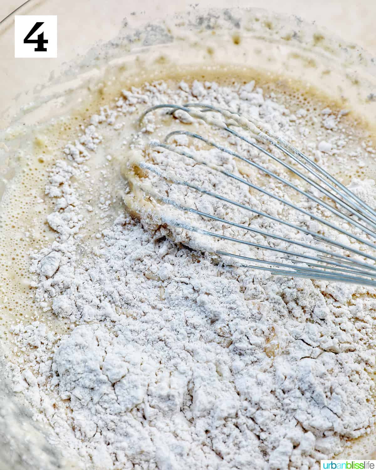 mixing dry ingredients into wet ingredients.