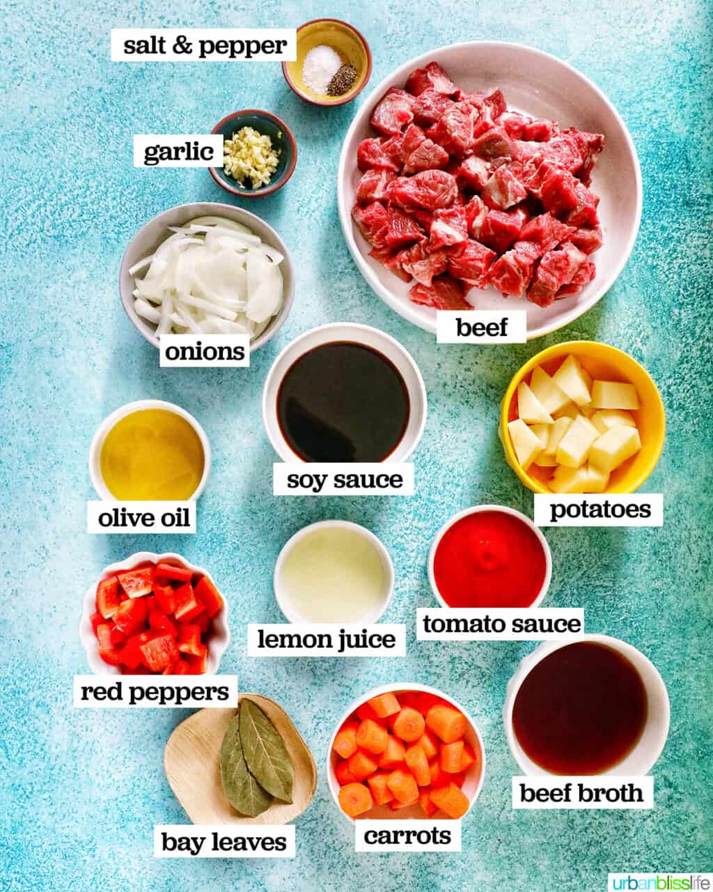 bowls of all of the ingredients needed to make beef mechado.
