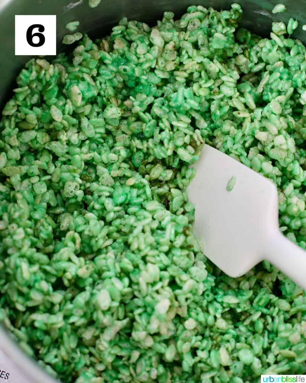 mixing the marshmallows and rice krispies