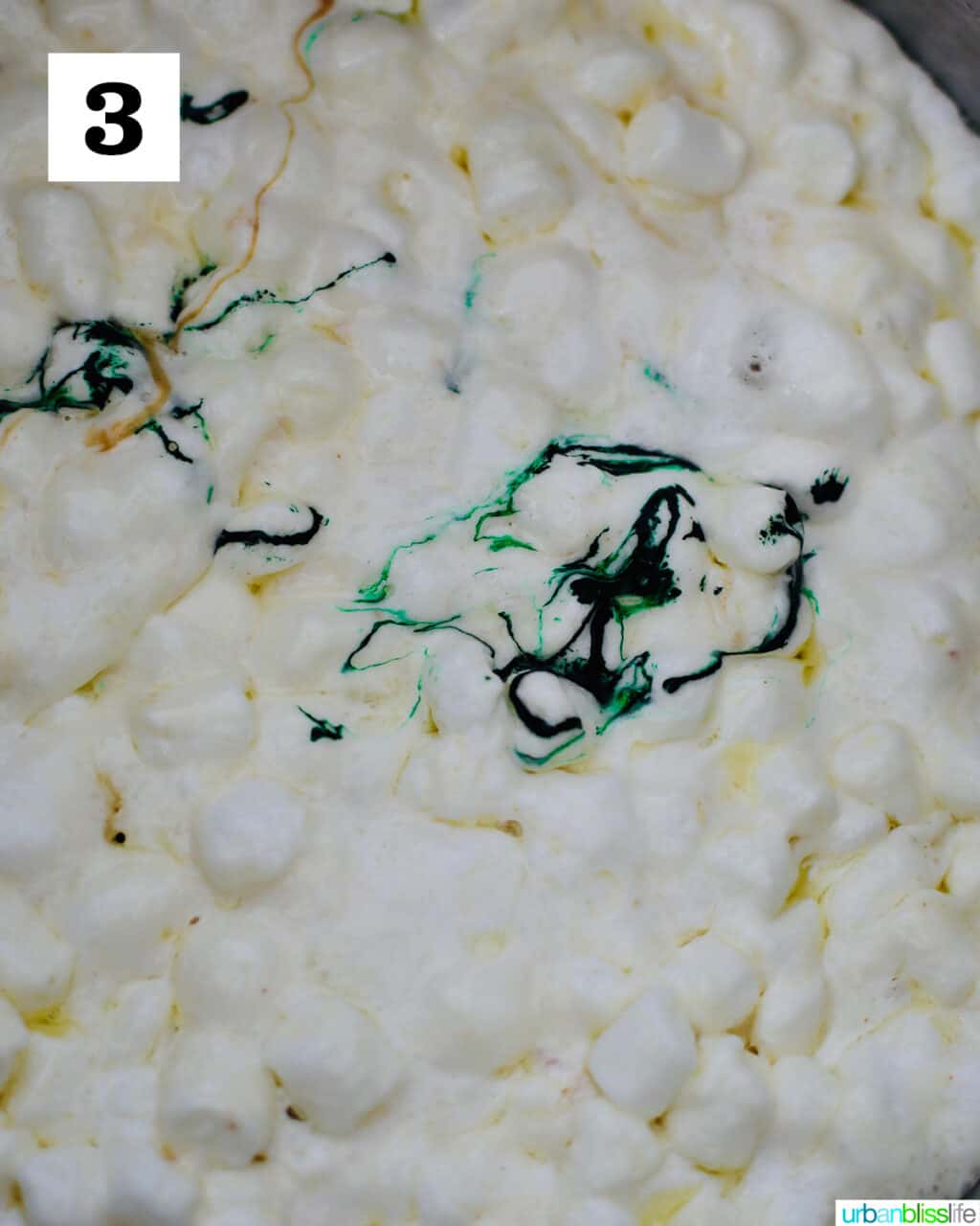 adding green food coloring to marshmallows