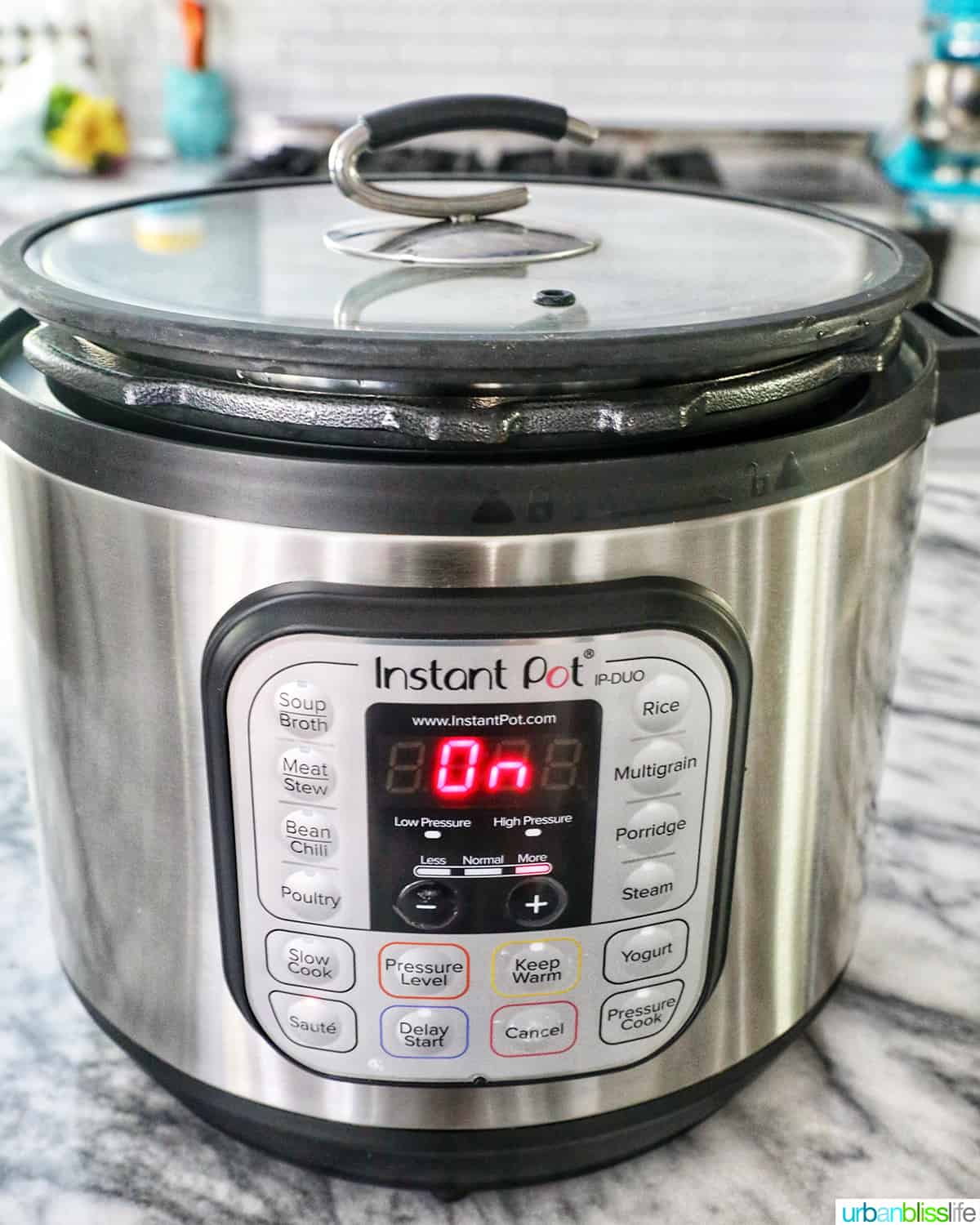 Instant Pot pressure cooker with a clear lid on top.