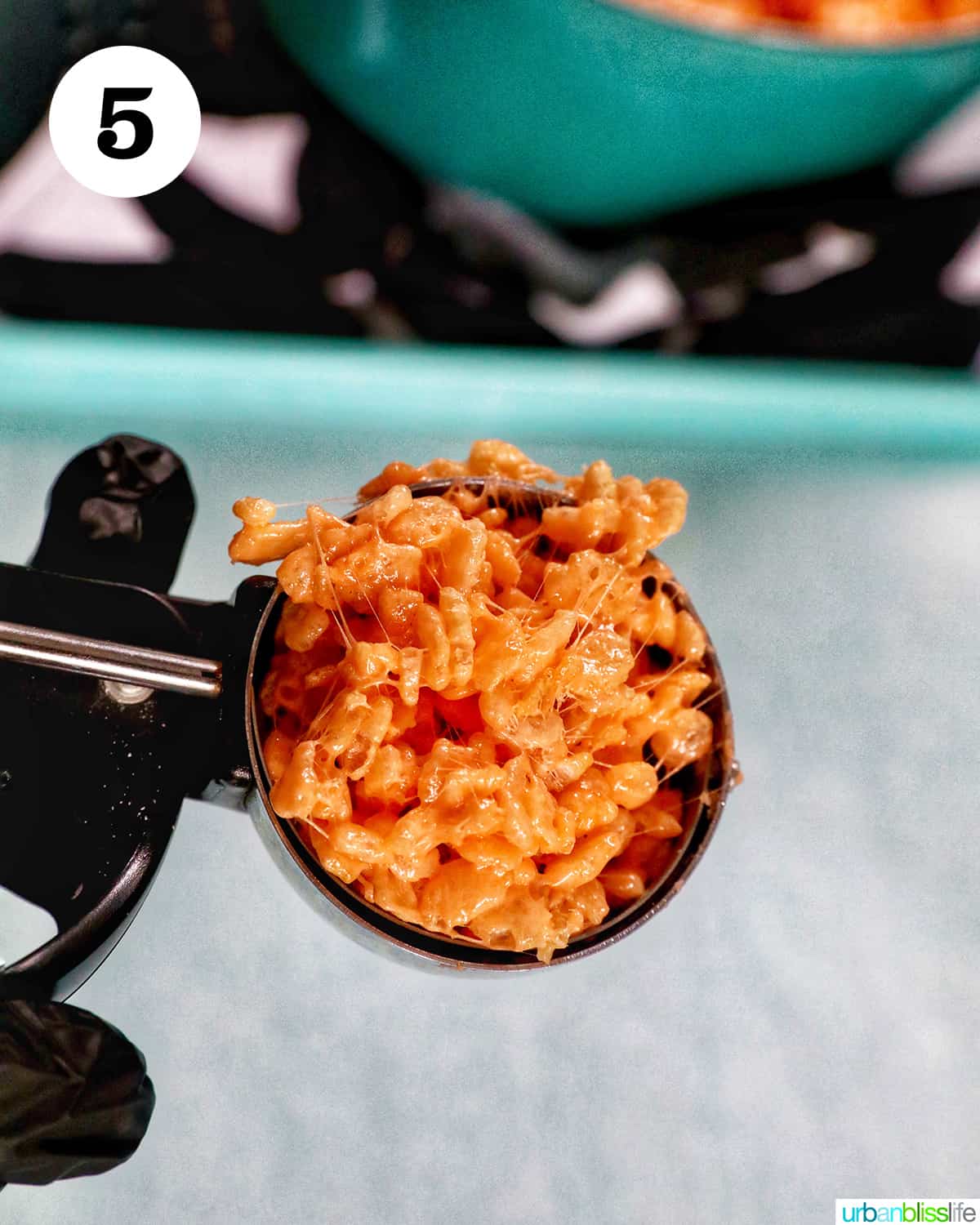 scoop of orange pumpkin rice krispie treats.