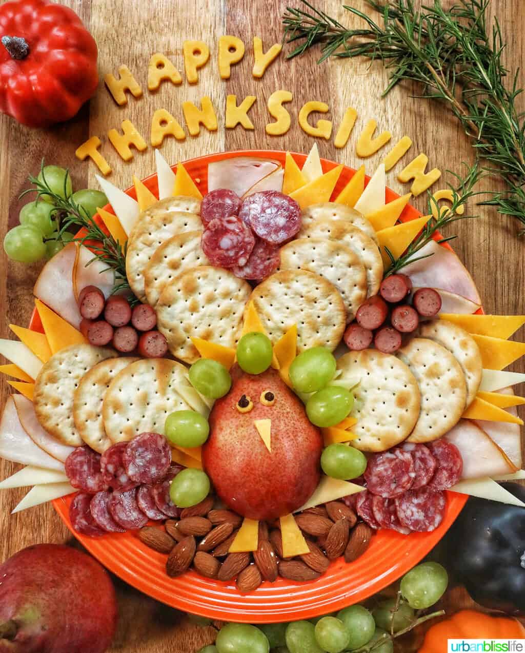 beautiful Thanksgiving turkey charcuterie board with cheese, meat, crackers, and fruit.