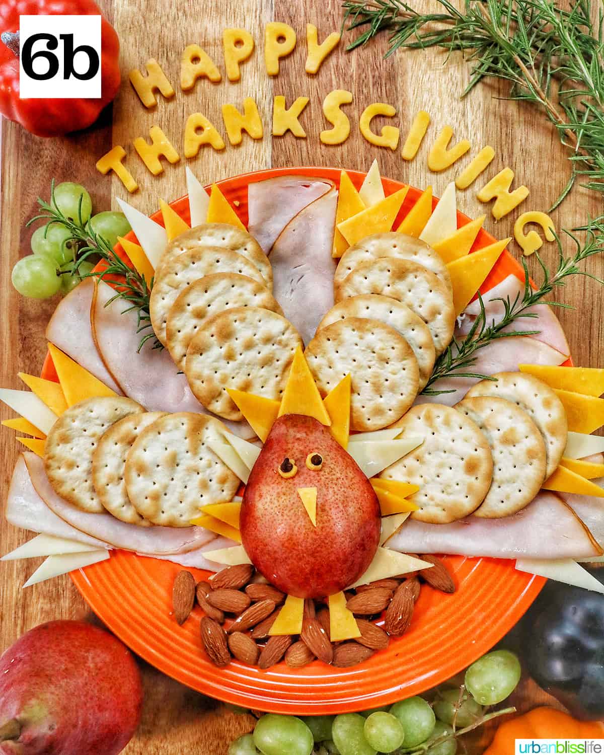 thanksgiving charcuterie board with turkey meat, cheeses, crackers.
