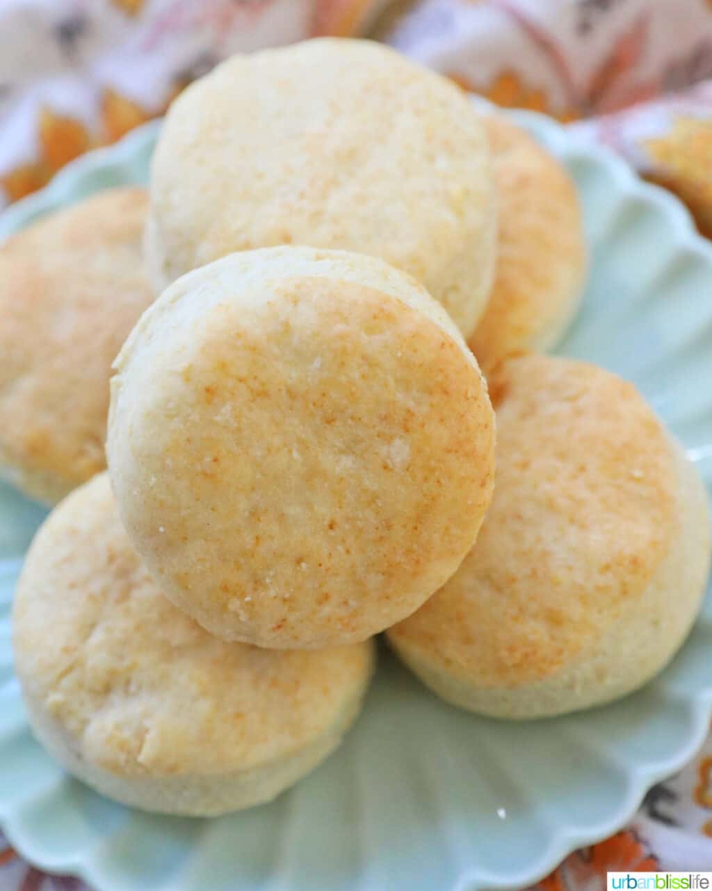 air fryer biscuits stacked on a plate.