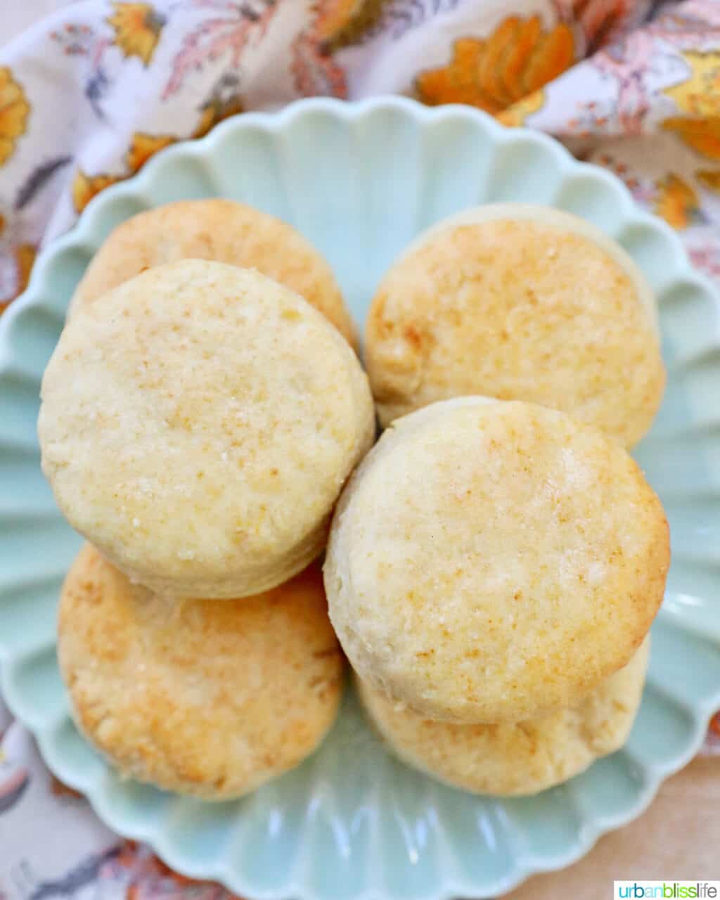 air fryer biscuits stacked on a plate.