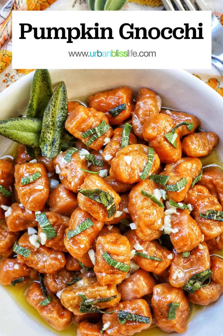 bowl of pumpkin gnocchi in sage butter sauce with title text overlay.