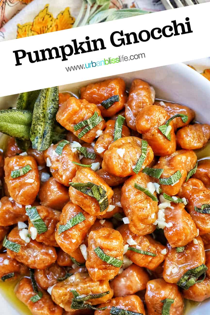 bowl of pumpkin gnocchi in sage butter sauce with title text overlay.