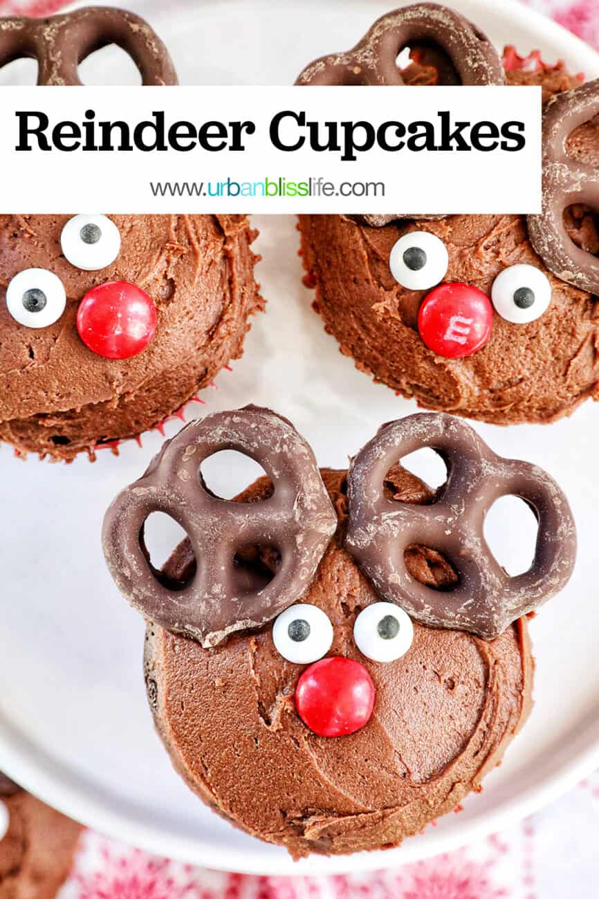 three reindeer cupcakes on a plate with title text overlay.