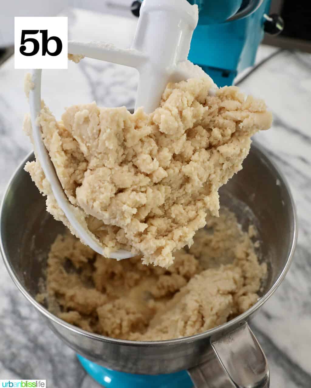 sugar cookie dough on a stand mixer paddle.