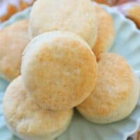 air fryer biscuits stacked on a plate.
