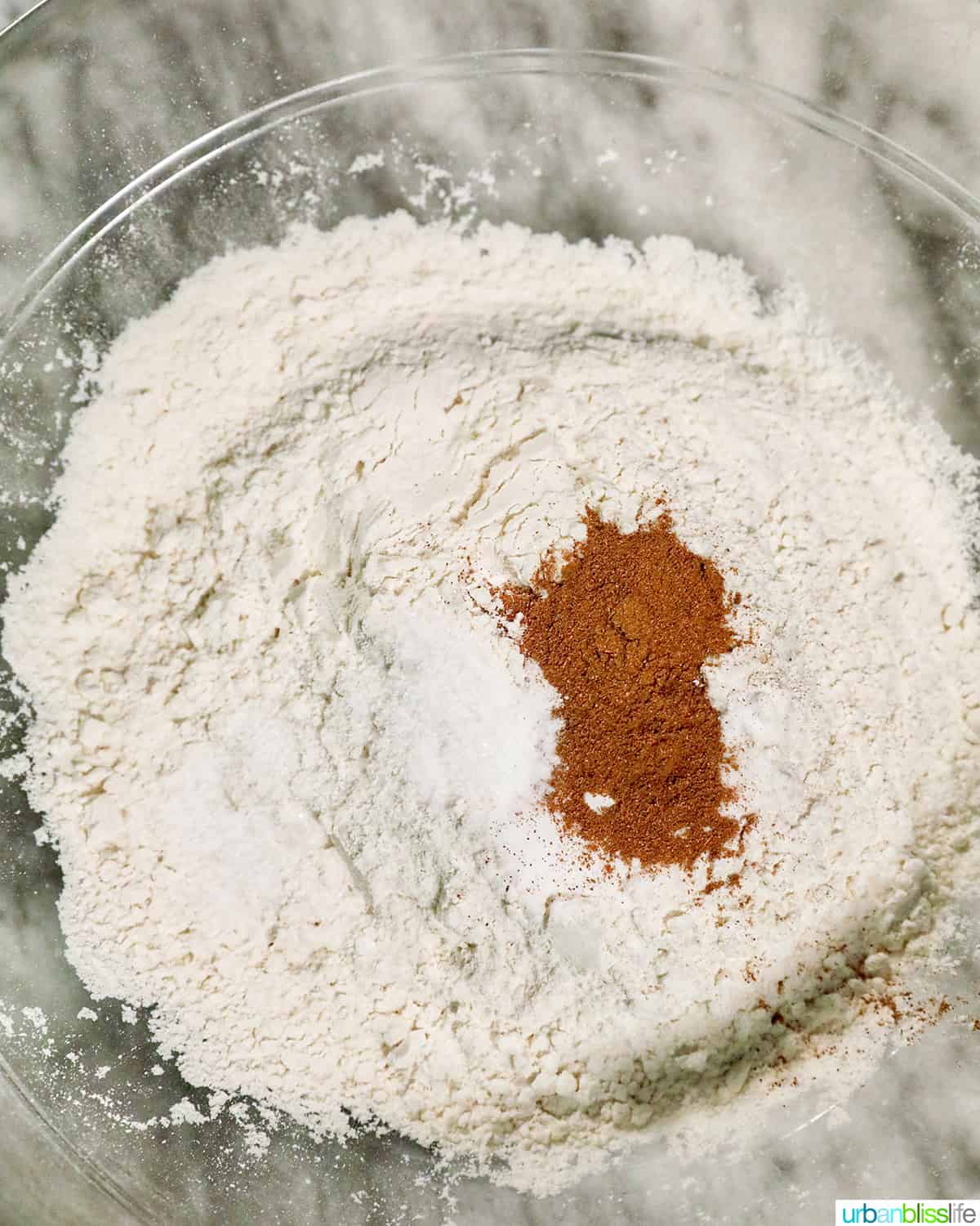 dry ingredients in a mixing bowl to make pumpkin banana muffins.
