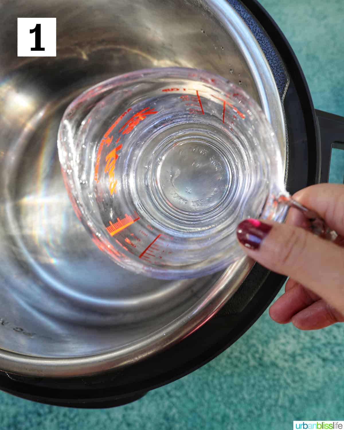 pouring water into the instant pot.