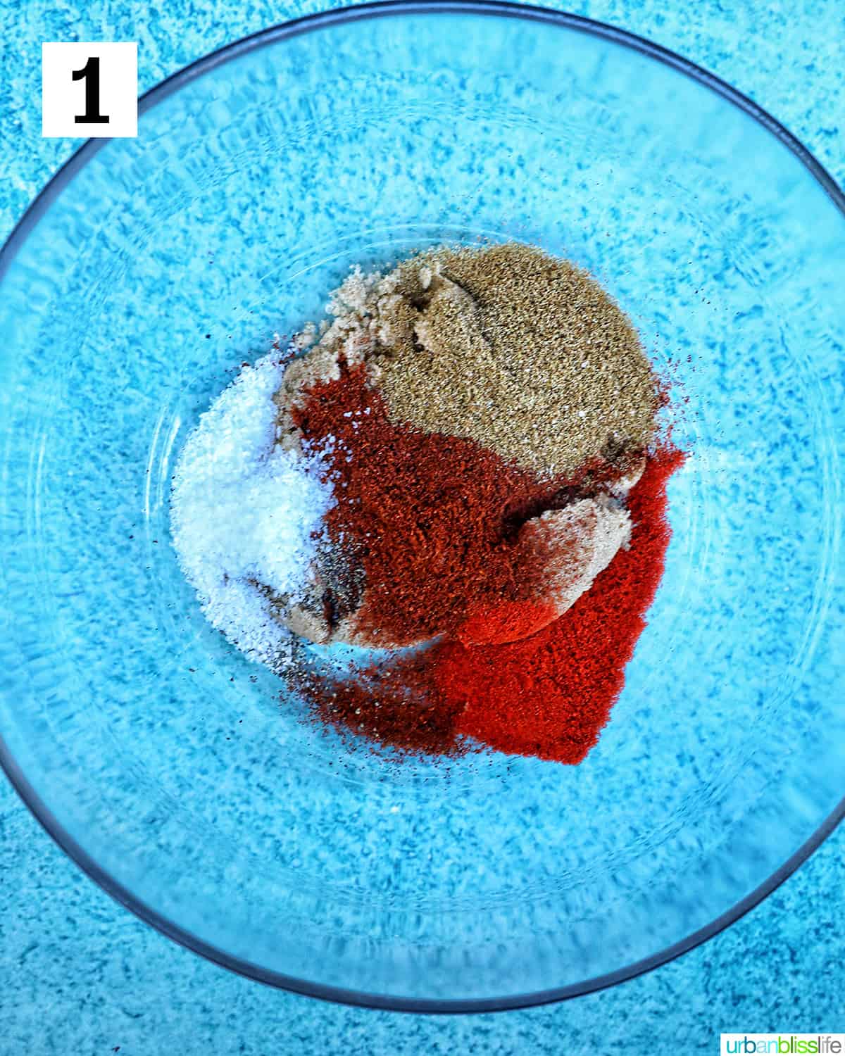 glass bowl full of spices to make Mexican shredded beef.