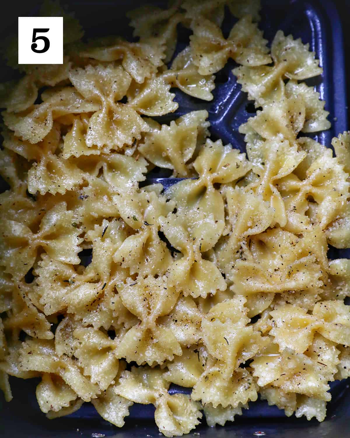 air fryer pasta chips in an air fryer basket.